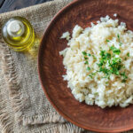 A bowl of Parmesan Risotto, exuding a rich and creamy texture, perfect standalone or as a base for other risotto variations.