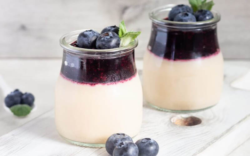 A serving of Homemade Panna Cotta, smooth and creamy, waiting to be adorned with a variety of toppings, showcasing its versatility as a favorite Italian dessert.