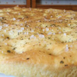 Focaccia Genovese, a cherished Italian bread known for its crispy exterior and soft interior
