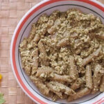 Pasta dish featuring fresh pesto sauce and tofu, a modern and healthier twist on classic Italian cuisine.